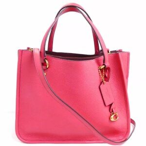 Coach Tyler 28 tote in watermelon and matching wallet set.
